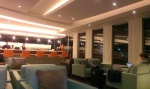 Etihad Airways guest lounge seating area with bar at Sydney Airport