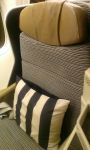 Etihad business class long haul seat with black and white striped pillow