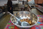 Loukoumades in a stainless steel bowl