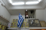 Greek flag and cheese tins on a shelf