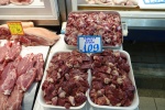 three trays of chicken giblets in the Athens meat market