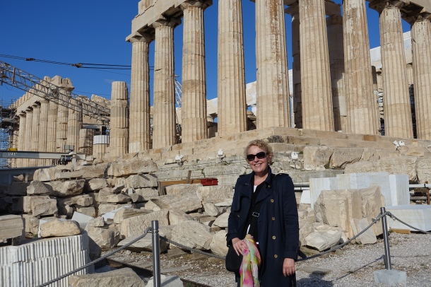 woman standing in front of the Parthenon in Athens