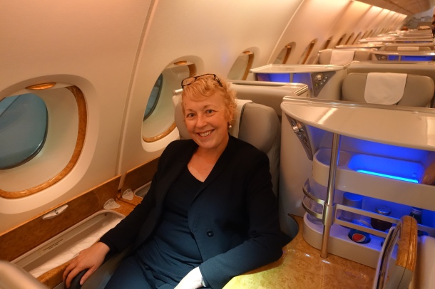 woman sitting in Emirates Business Class A380