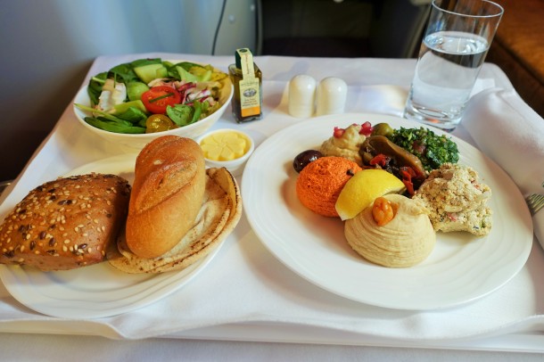 Emirates business meal, meze plate, salad, bread rolls on tray