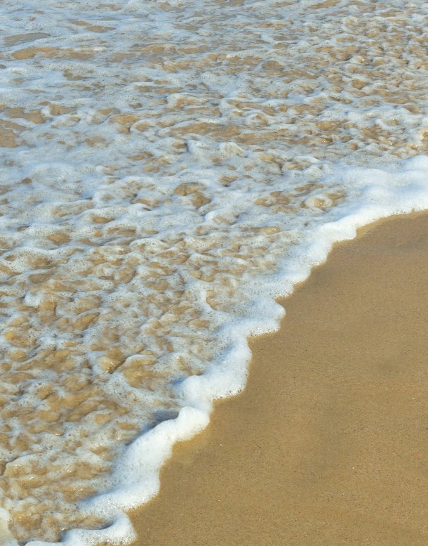waves lapping on a beach, Phuket, Thailand